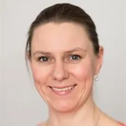 A close-up of a woman smiling