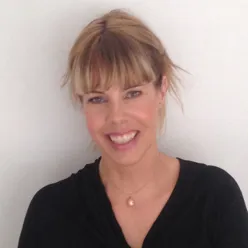 A woman smiling for the camera