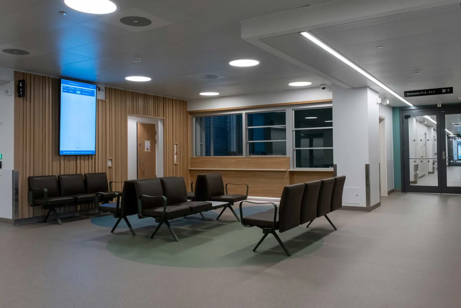 A room with chairs and a screen