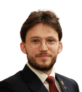 En mann med briller og dress