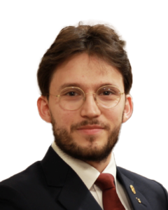 En mann med briller og dress