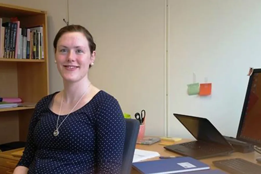 A woman sitting at a desk