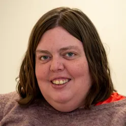 A woman with a large smile